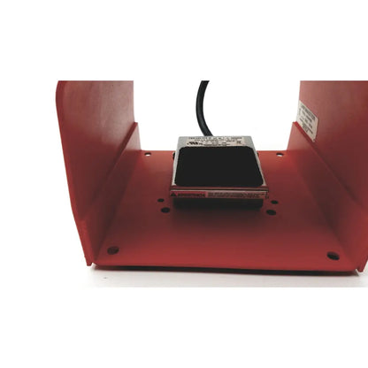 Red linemaster cat treadlite ii foot switch with black rubber top metallic housing and spanish warning label