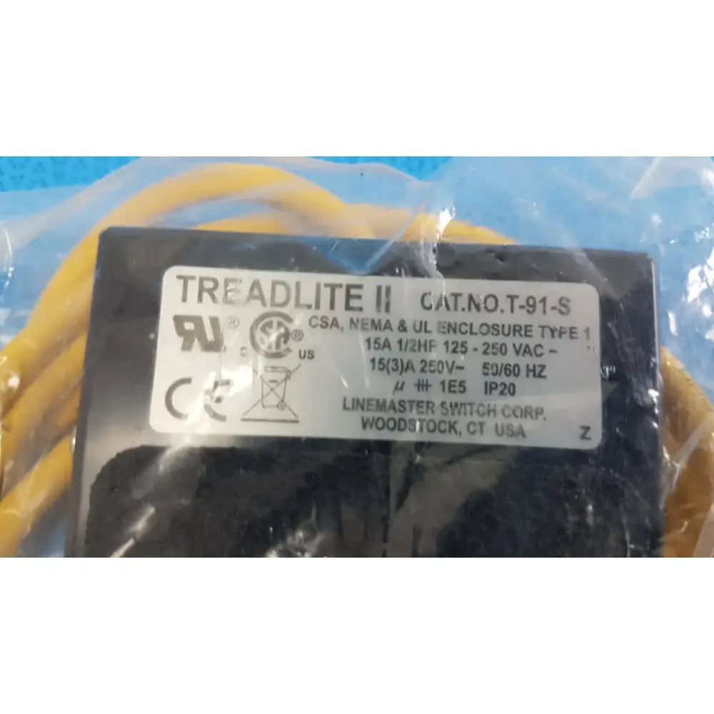 Black Linemaster Treadlite II T-91-S foot switch electrical enclosure with white label showing specifications and certifications