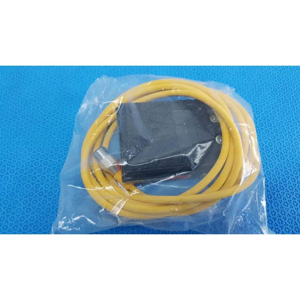 Yellow coiled cable with black rectangular connector and metallic end cap for linemaster treadlite t-91-s foot switch electric pedal