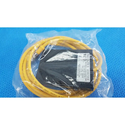 Yellow coiled cable and black power supply unit inside clear packaging for linemaster treadlite t-91-s foot switch