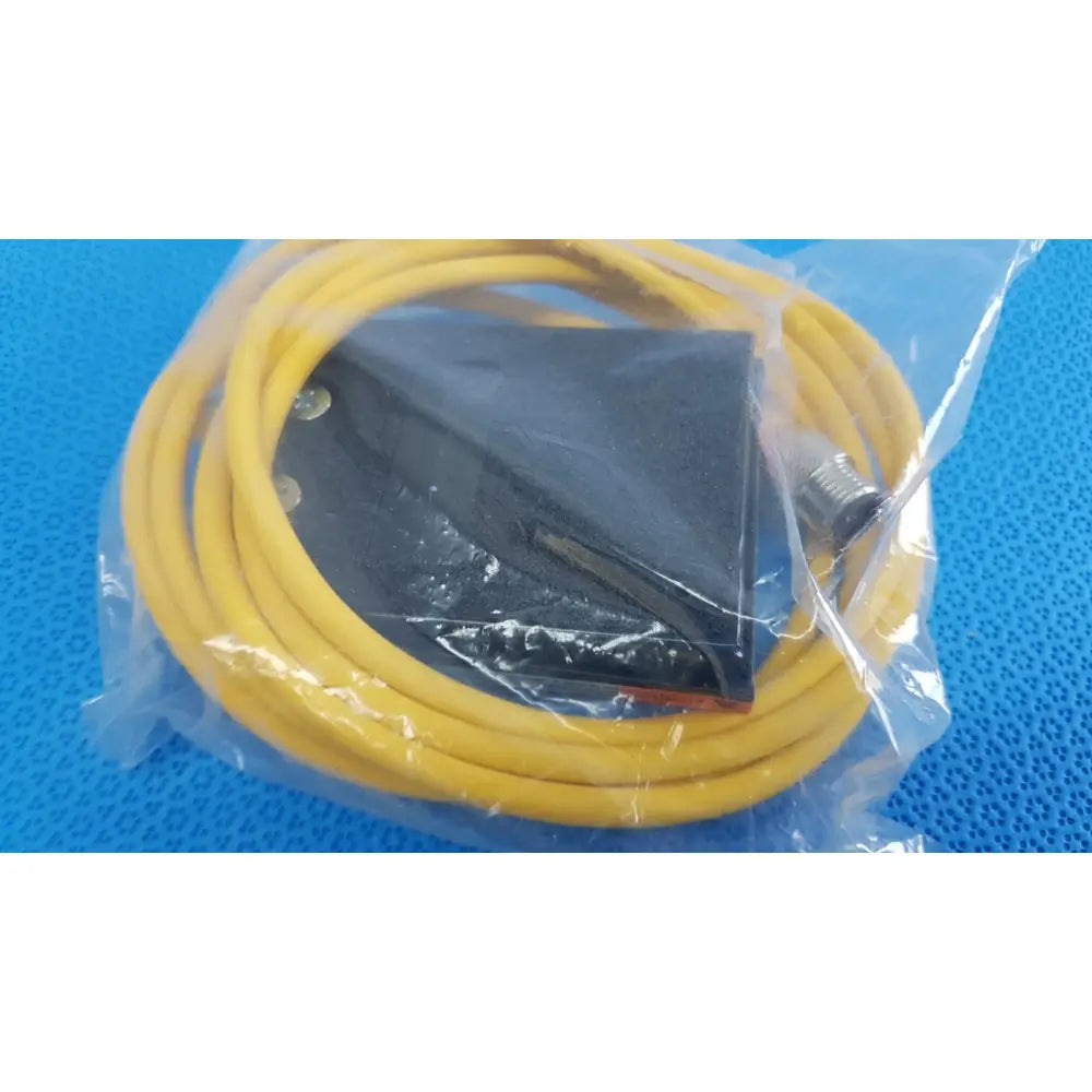 Yellow coiled cable with black sensor and metallic connector for linemaster treadlite t-91-s foot switch electric pedal