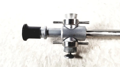 Linvatec 118100 L 354530 silver metallic laparoscopy cannula with black rubberized eyepiece and knurled adjustment knobs