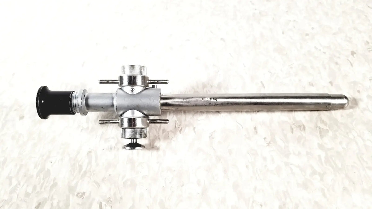 Silver-colored Linvatec 118100 L 354530 laparoscopy cannula with black eyepiece and metallic joints for reuse medical use
