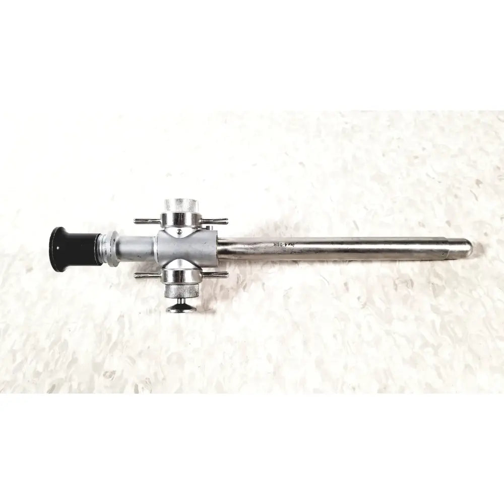 Silver-colored Linvatec 118100 L 354530 laparoscopy cannula with black eyepiece and metallic joints for reuse medical use