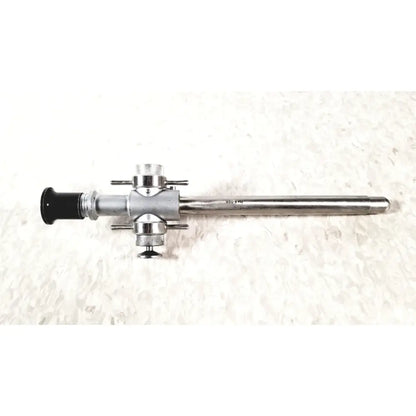 Silver-colored Linvatec 118100 L 354530 laparoscopy cannula with black eyepiece and metallic joints for reuse medical use