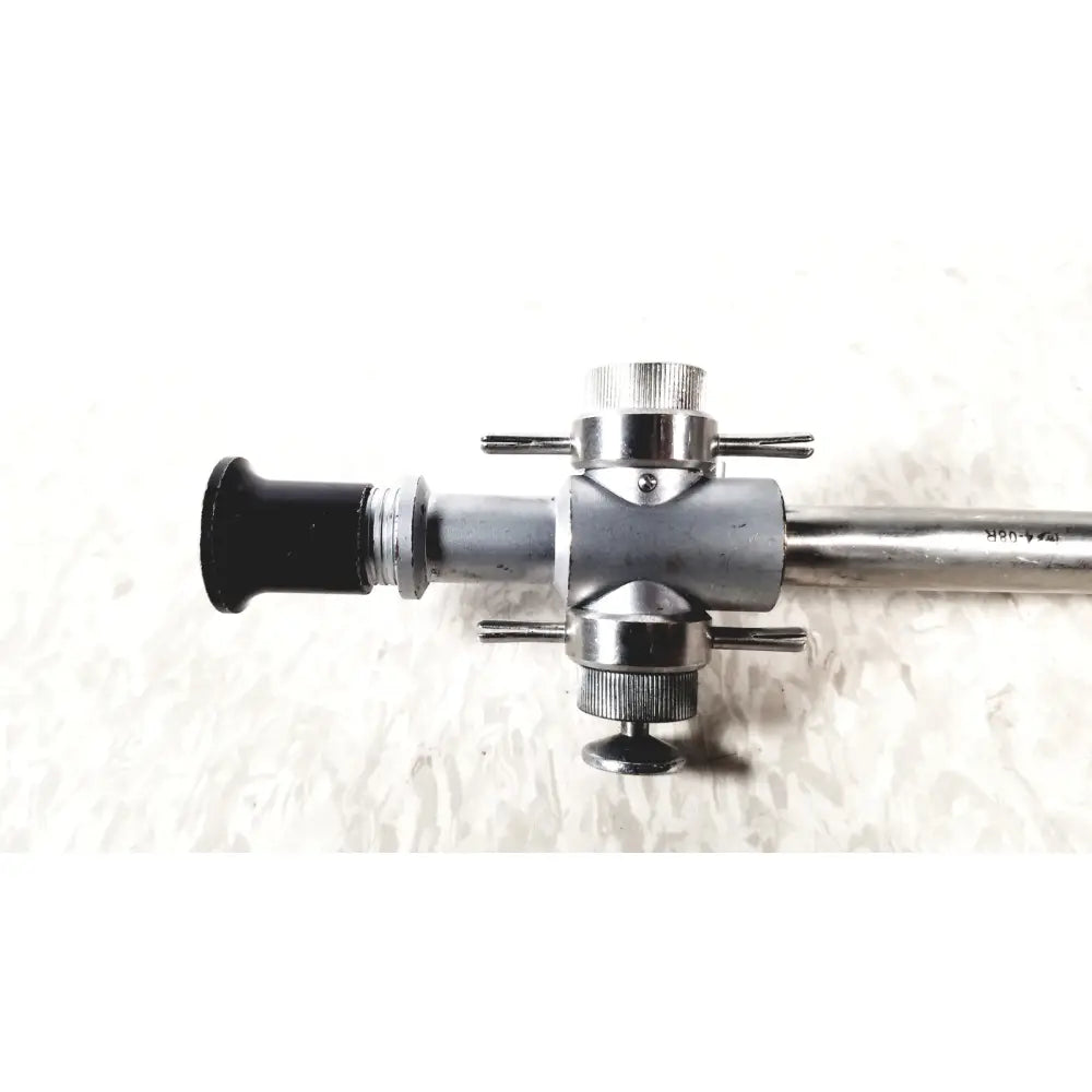 Linvatec 118100 L 354530 silver metallic laparoscopy cannula with black rubberized eyepiece and knurled adjustment knobs