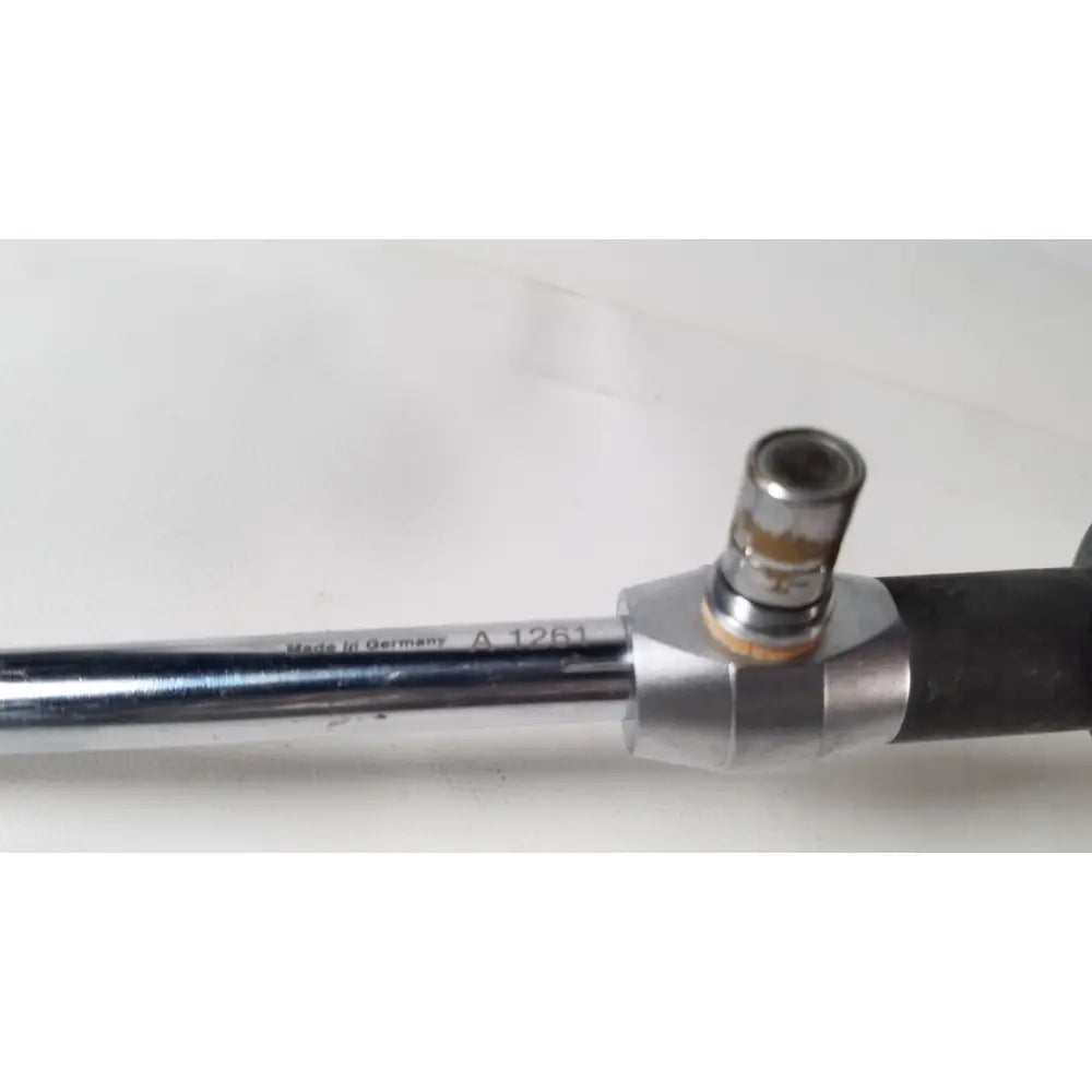 Chrome finished metal pipe with black rubber grip and brass connector marked made in germany for linvatec 757830 degree laparoscope a1261