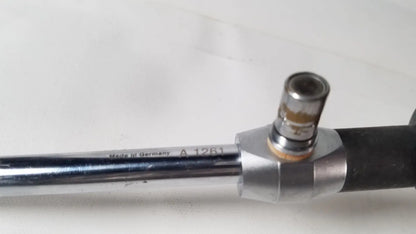 Chrome finished metal pipe with black rubber grip and brass connector marked made in germany for linvatec 757830 degree laparoscope a1261