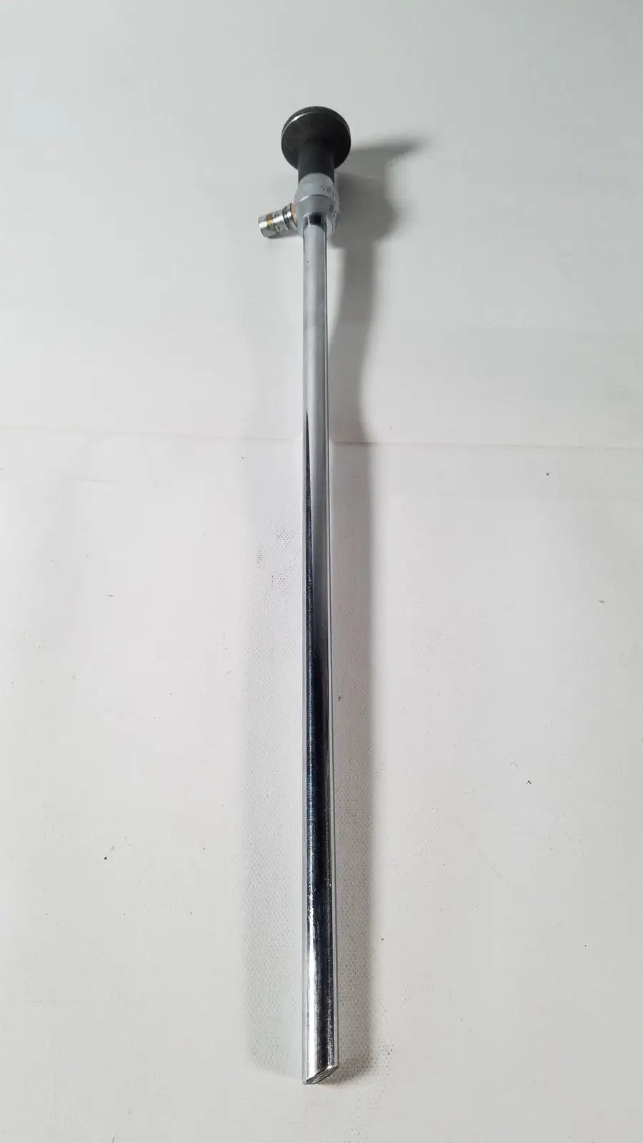 Silver metallic linvatec 757830 degree laparoscope a1261 with black rubberized handle and threaded metal fittings