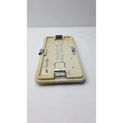 Beige plastic surgical tissue retraction system with metal clamps labeled spectraflow in linvatec concept arthroscopy spectrum tray