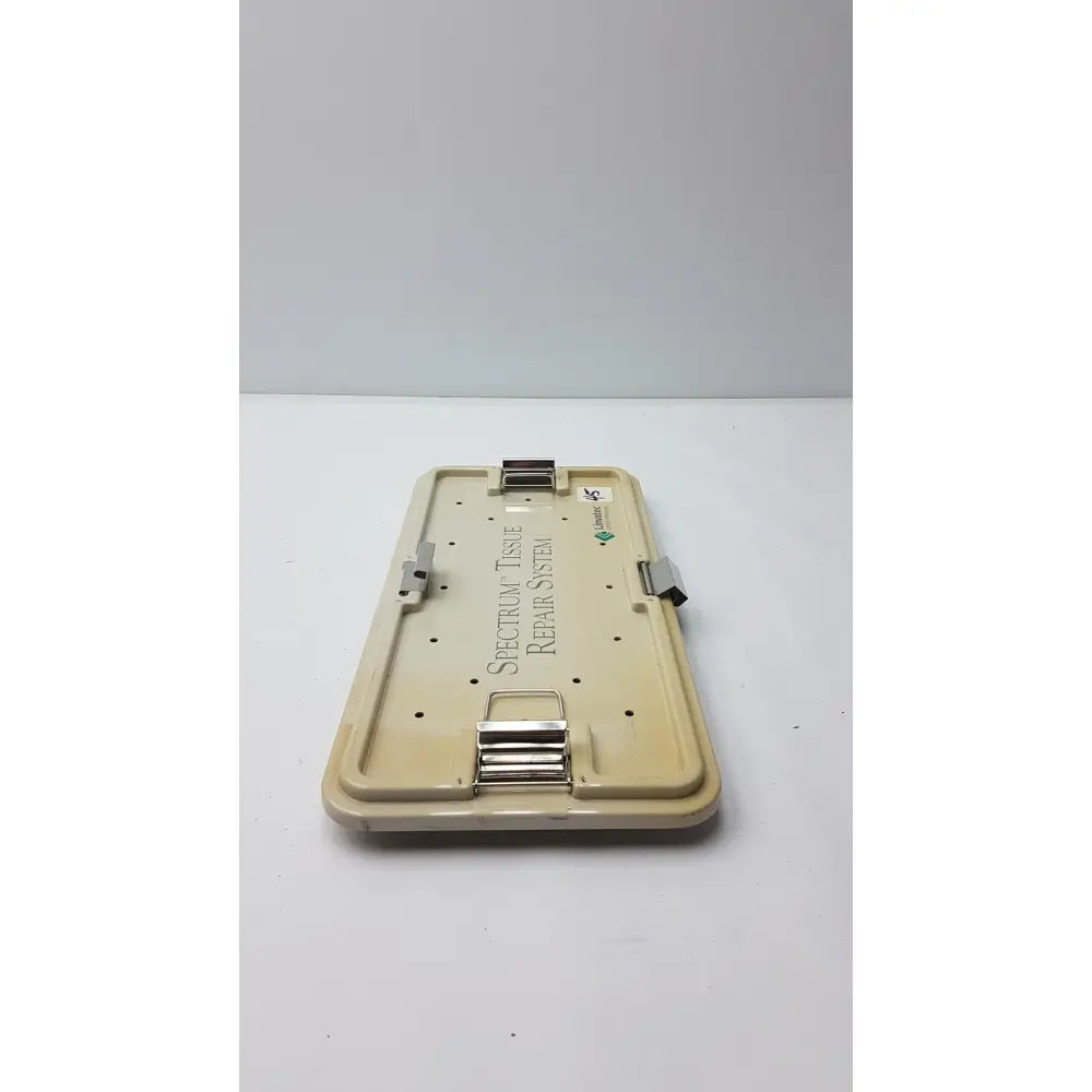 Beige plastic case with metallic clasp labeled spectrum tissue repair system for linvatec concept arthroscopy spectrum tray