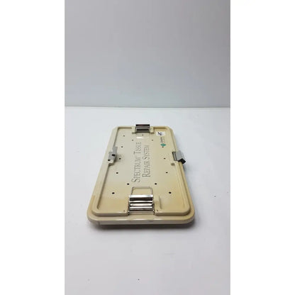 Beige plastic case with metallic clasp labeled spectrum tissue repair system for linvatec concept arthroscopy spectrum tray