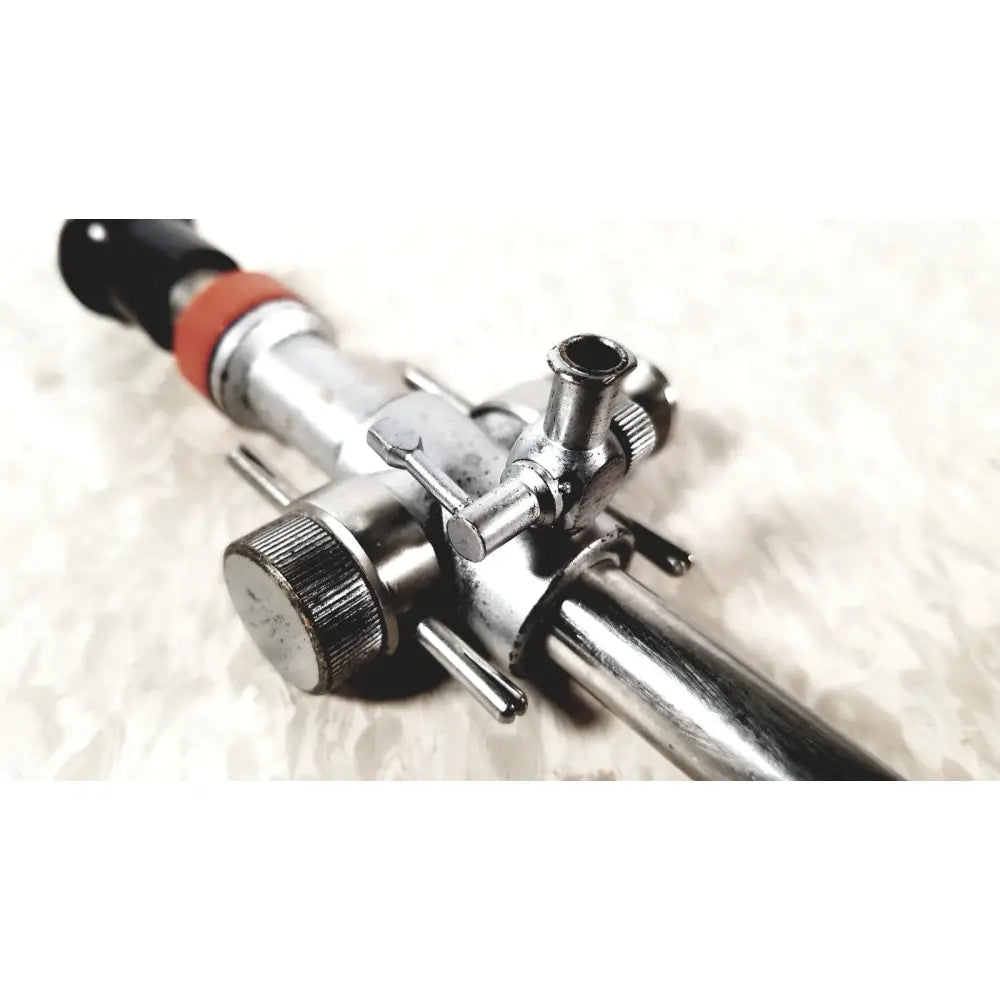 Silver metallic linvatec conmed 118100 hasson laparoscopic valve gas regulator with black and orange accents