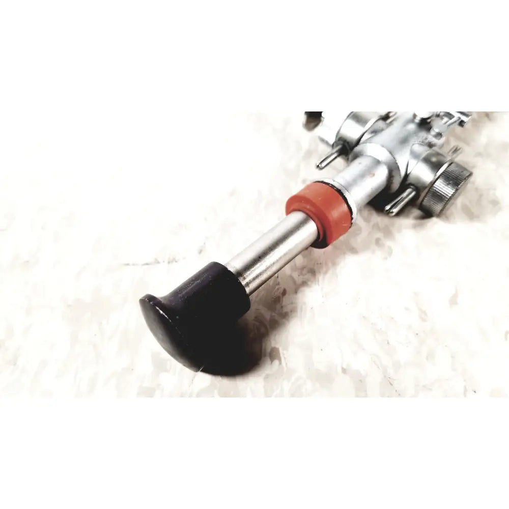 Silver metal bicycle pedal with black rubber grip and red plastic collar for linvatec conmed hasson laparoscopic valve