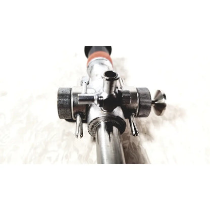 Silver metallic linvatec conmed hasson laparoscopic valve with textured knobs and black-tipped handle for surgery