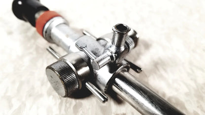 Silver metallic linvatec conmed 118100 hasson laparoscopic valve gas regulator with black and orange accents