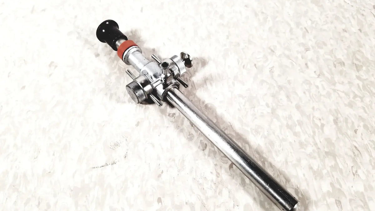 Silver surgical retractor with black and red accents for linvatec conmed hasson laparoscopic valve use
