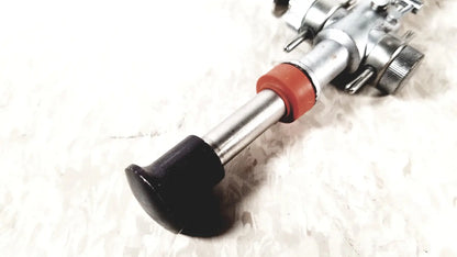 Silver metal bicycle pedal with black rubber grip and red plastic collar for linvatec conmed hasson laparoscopic valve