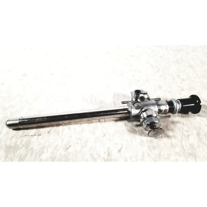 Silver linvatec conmed laparoscopic valve endoscope with black lens cap and metallic adjustment knobs for reuse medical use