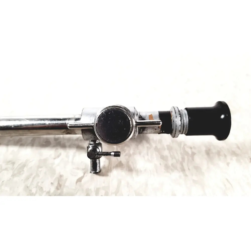 Linvatec Conmed 118100 laparoscopic valve with chrome finish, black cylindrical tip, adjustment knobs, and small valve for reuse medical use