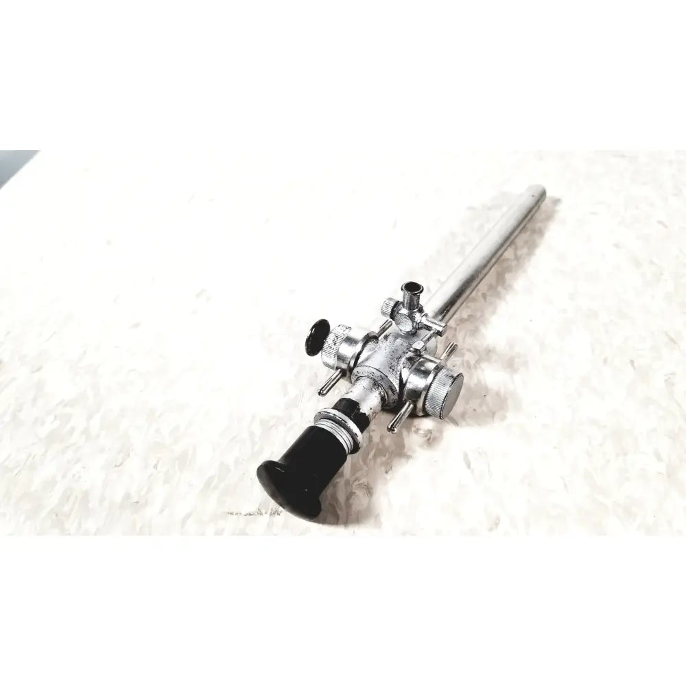 Linvatec Conmed laparoscopic valve with silver-colored endoscope and black handle featuring adjustment knobs