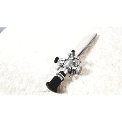 Linvatec Conmed laparoscopic valve with silver-colored endoscope and black handle featuring adjustment knobs