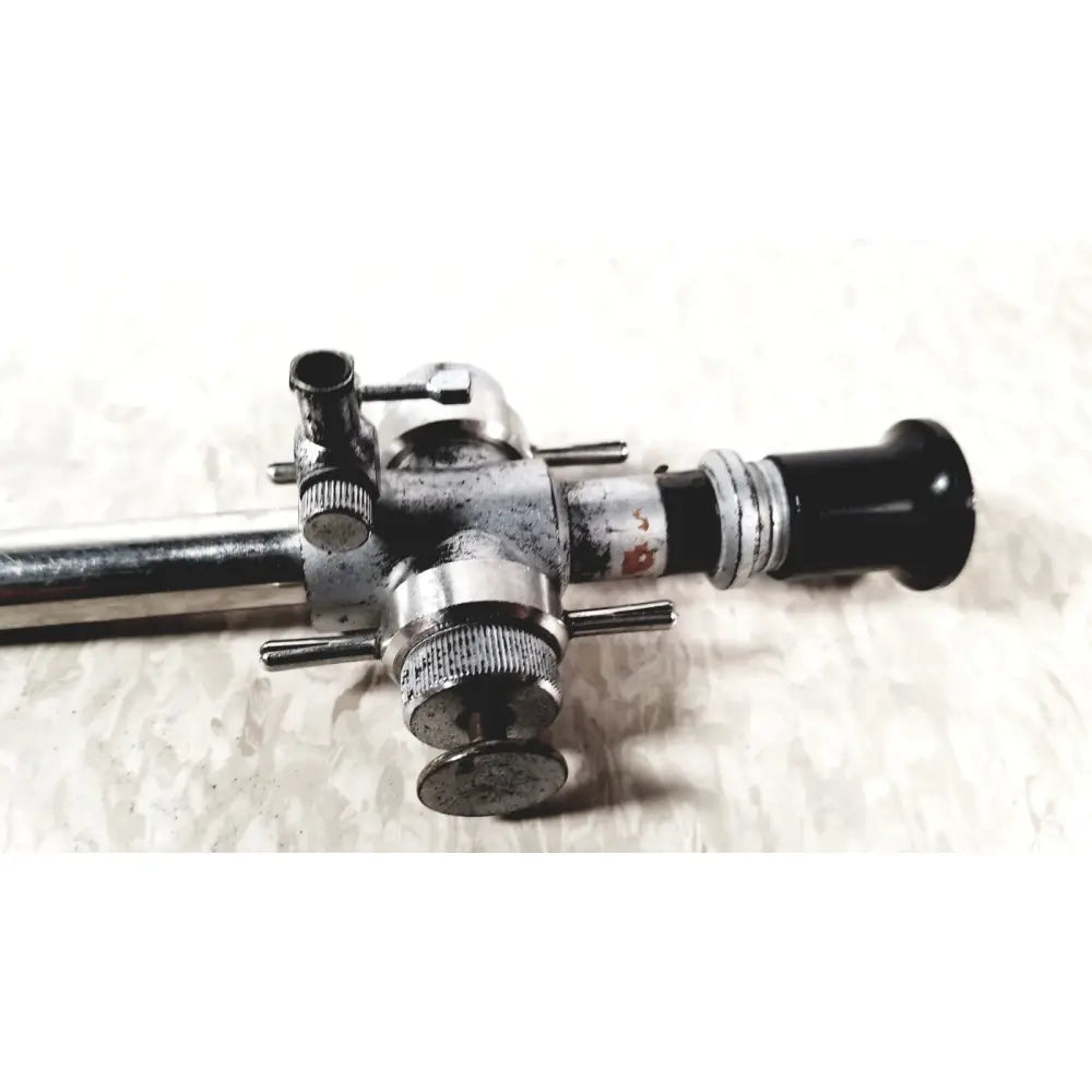 Vintage silver and black linvatec conmed 118100 laparoscopic valve with worn metallic finish for reuse medical endoscopy