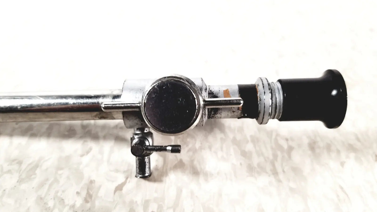 Linvatec Conmed 118100 laparoscopic valve with chrome finish, black cylindrical tip, adjustment knobs, and small valve for reuse medical use