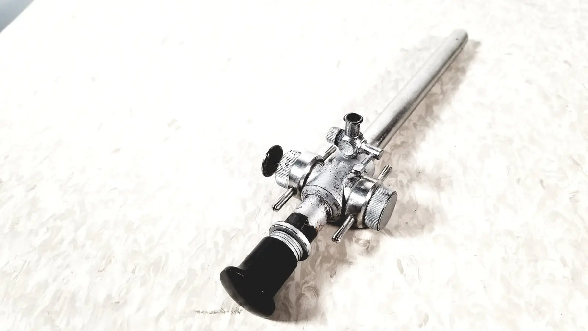 Linvatec Conmed laparoscopic valve with silver-colored endoscope and black handle featuring adjustment knobs