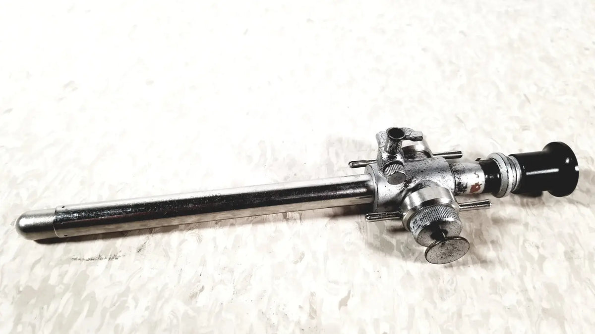 Silver linvatec conmed laparoscopic valve endoscope with black lens cap and metallic adjustment knobs for reuse medical use
