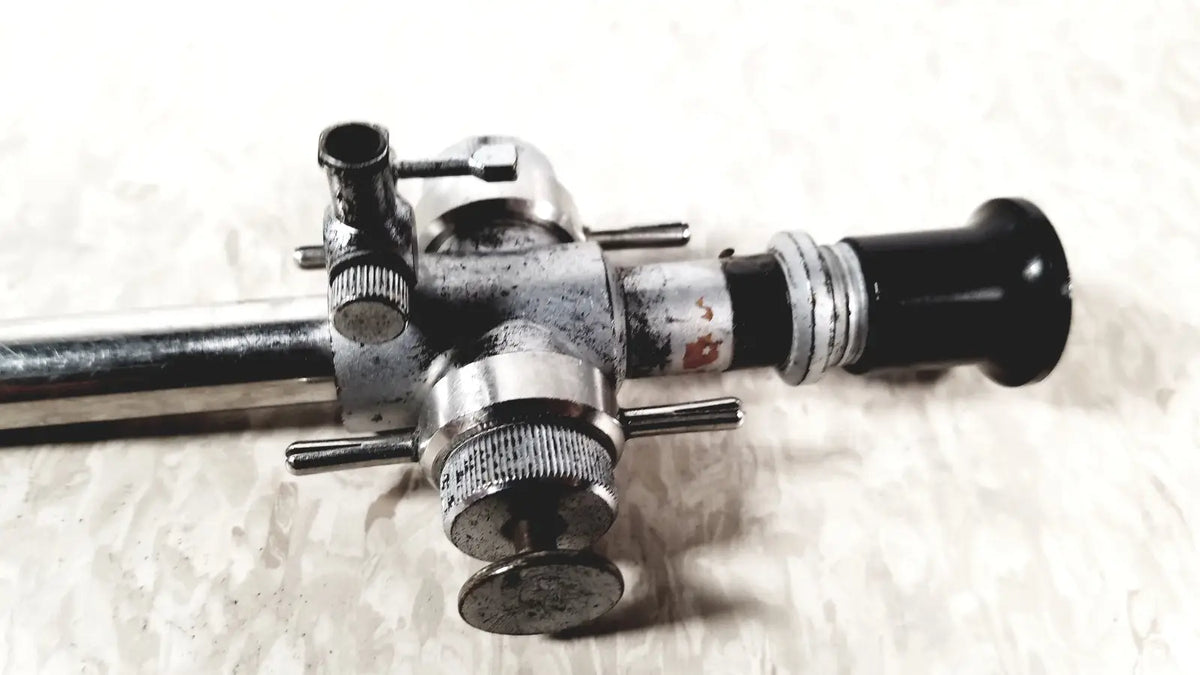 Vintage silver and black linvatec conmed 118100 laparoscopic valve with worn metallic finish for reuse medical endoscopy