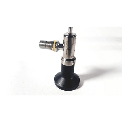 Silver and black linvatec ql4700 quicklatch 4mm arthroscope arthroscopy with metallic joints and yellow ring accent