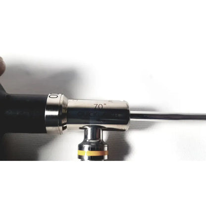 Silver-colored linvatec ql4700 quicklatch 4mm arthroscope arthroscopy instrument with engraved markings and black grip