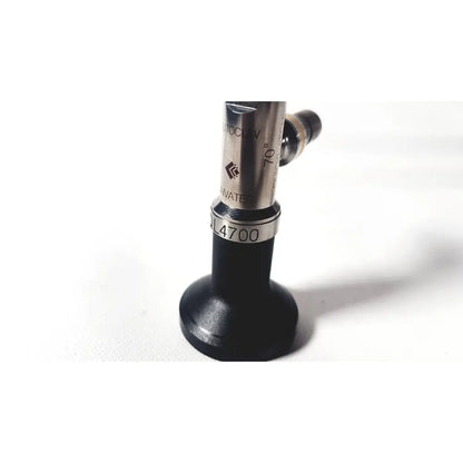 Silver and black linvatec ql4700 quicklatch 4mm arthroscope arthroscopy with engraved markings and cylindrical metallic body