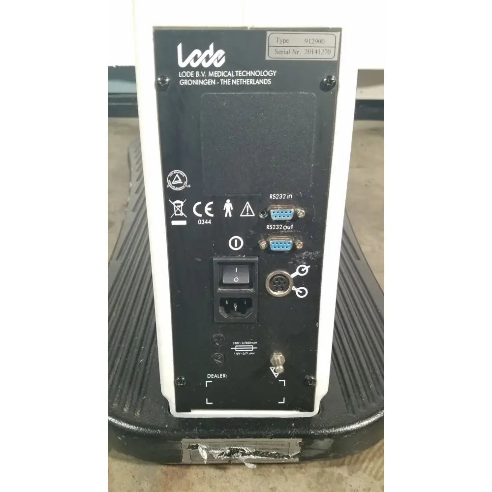 Black and white lode corival 912900 ergometer stress test device back with rs232 ports power switch and serial number label