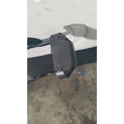 Black plastic textured seat belt buckle with circular indentations for lode corival 912900 ergometer stress test ecg use