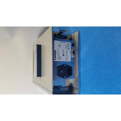 Beige and blue lonza core unit transfection thermal printer with black power switch ethernet port and serial connector backside