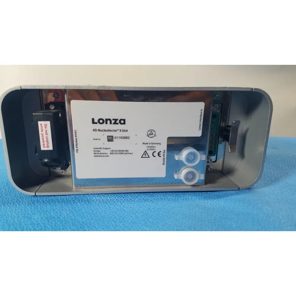 Lonza 4d-nucleofector x unit is a sleek metallic gray laboratory device with clear labeling and transparent fluid connectors