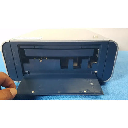 Blue plastic lonza 4d-nucleofector x unit printer with hinged front panel open revealing internal components for reuse medical