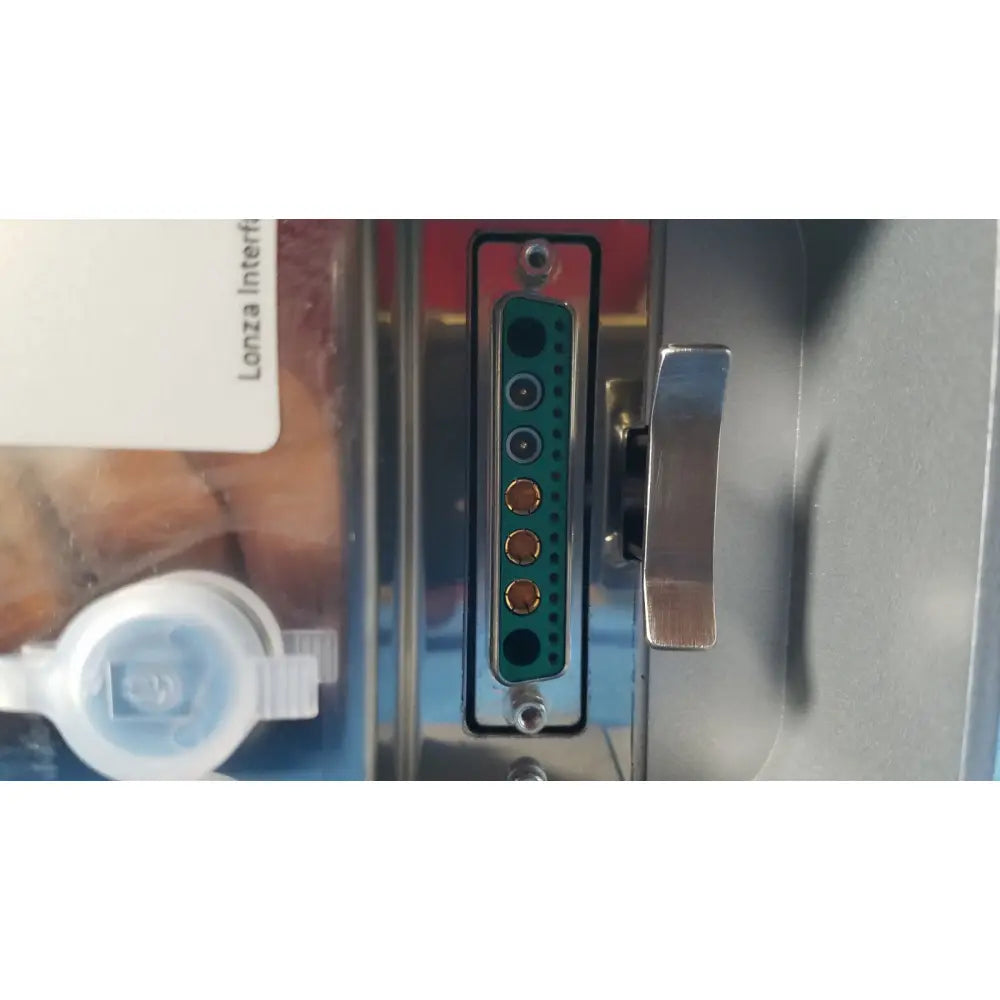 Backside of lonza 4d-nucleofector x unit showing green dvi-i digital video connector with metallic pins and silver latch