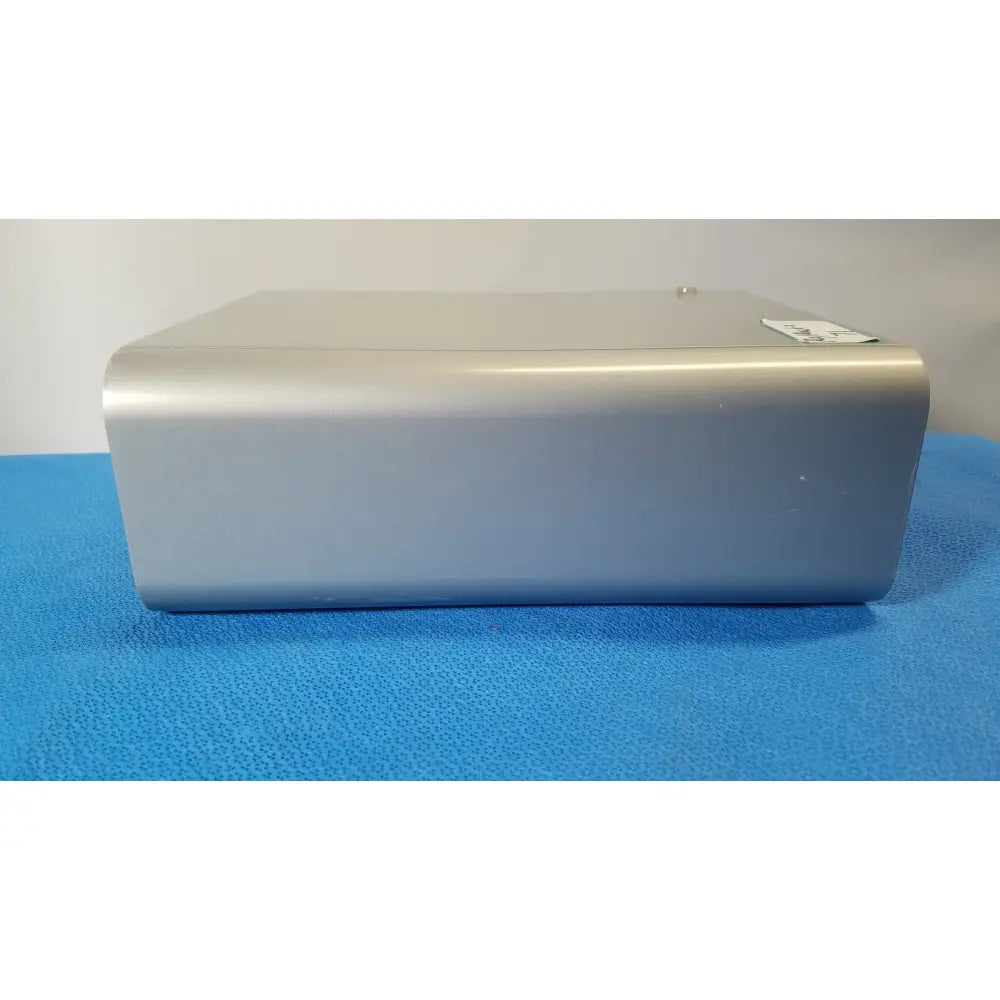 Silver metallic rectangular lonza 4d-nucleofector x unit with rounded edges and label for reuse medical applications