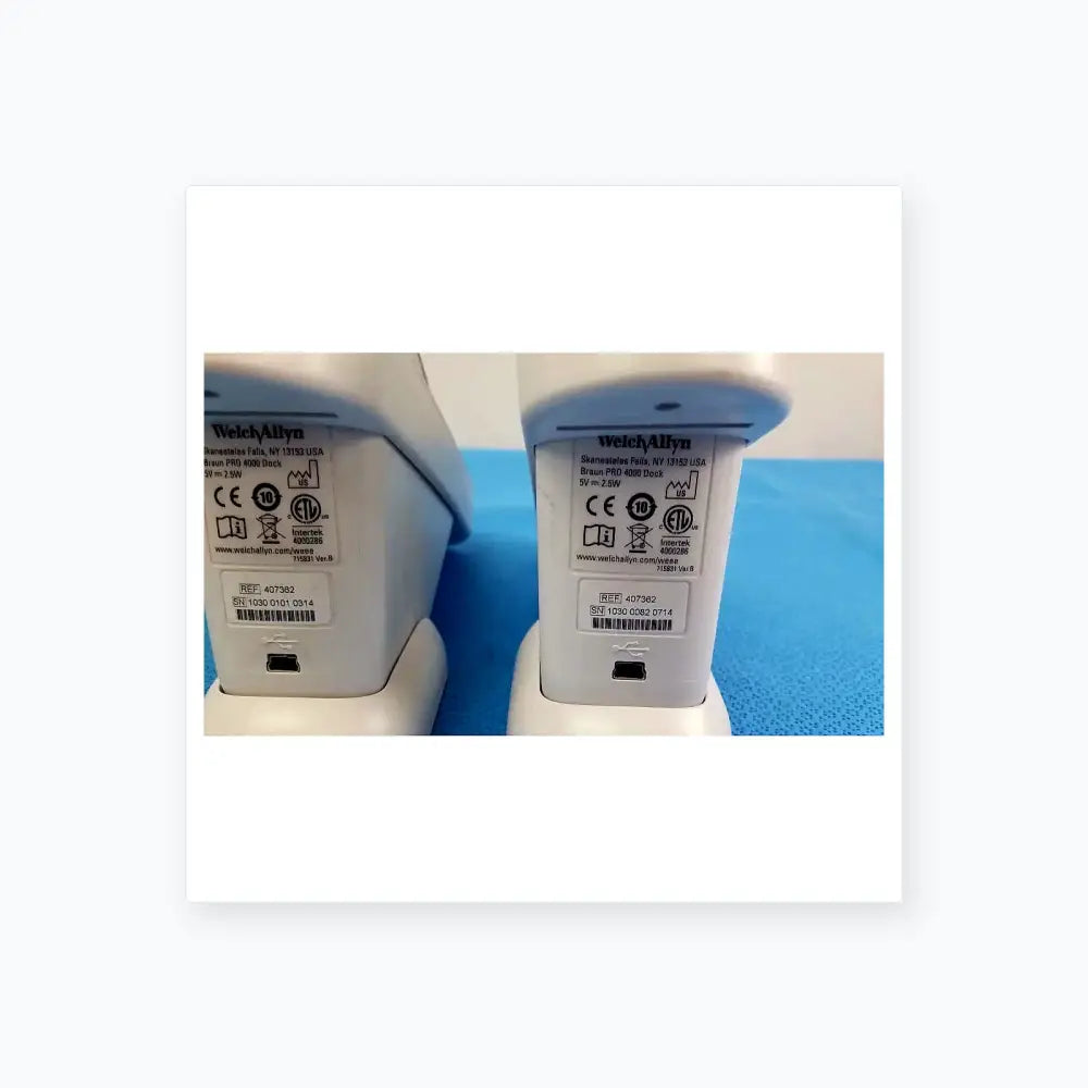 White plastic braun pro 4000 thermo scan charging dock with matte finish and label for reuse medical equipment lot of 2