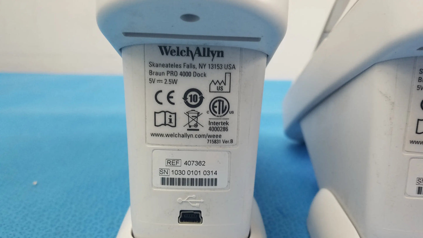 White plastic braun pro 4000 dock charging station with usb port and regulatory labels for reuse medical equipment