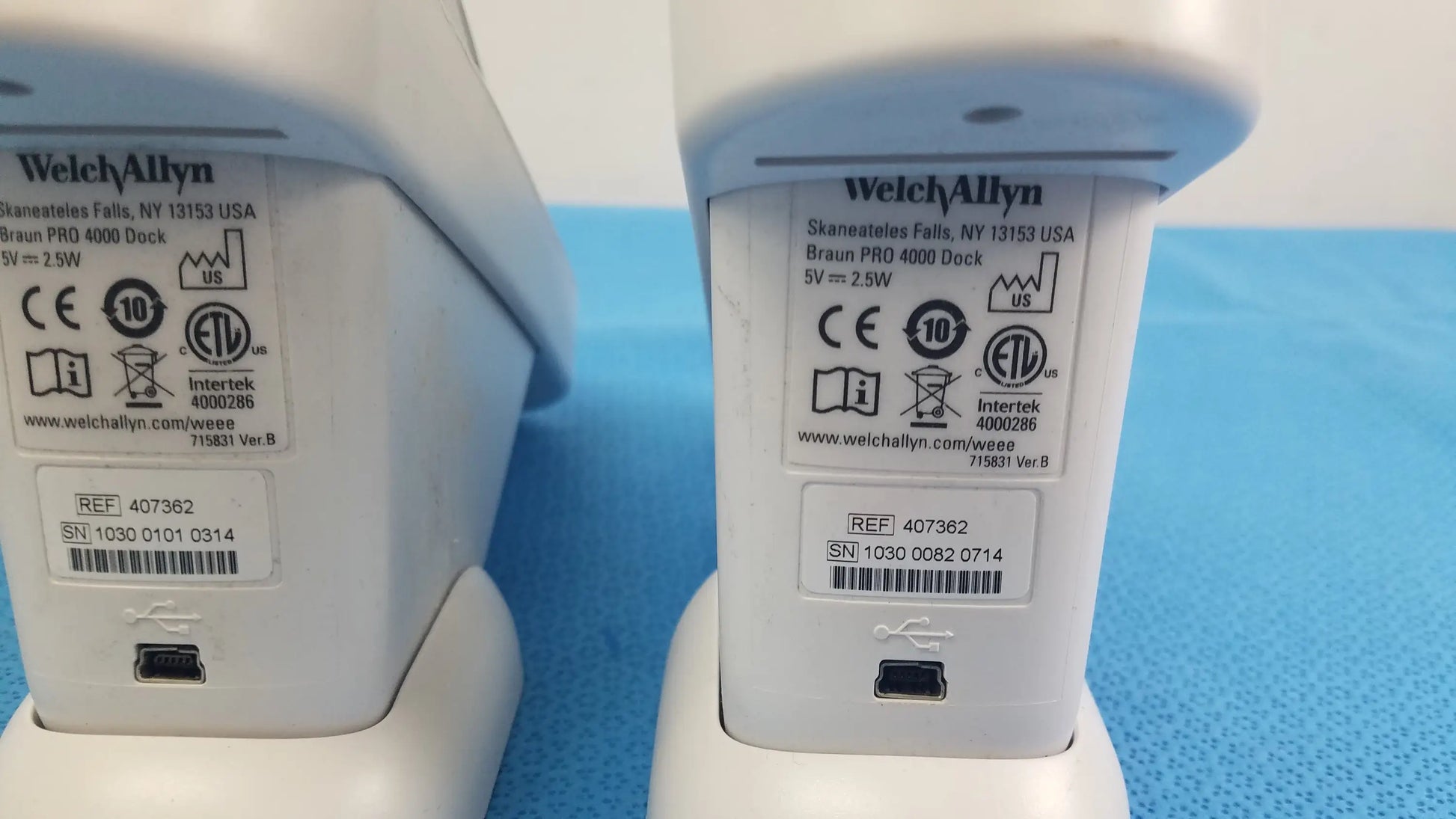 White plastic braun pro 4000 thermo scan charging dock with matte finish and label for reuse medical equipment lot of 2