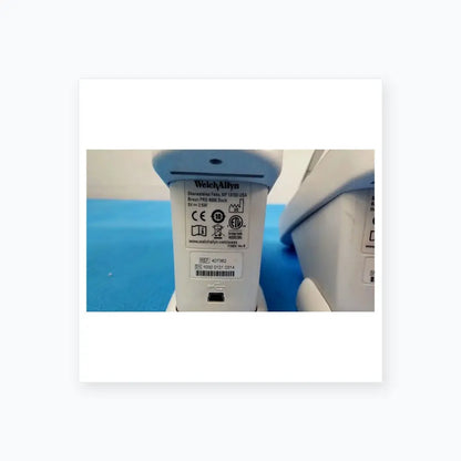 White plastic braun pro 4000 dock charging station with usb port and regulatory labels for reuse medical equipment