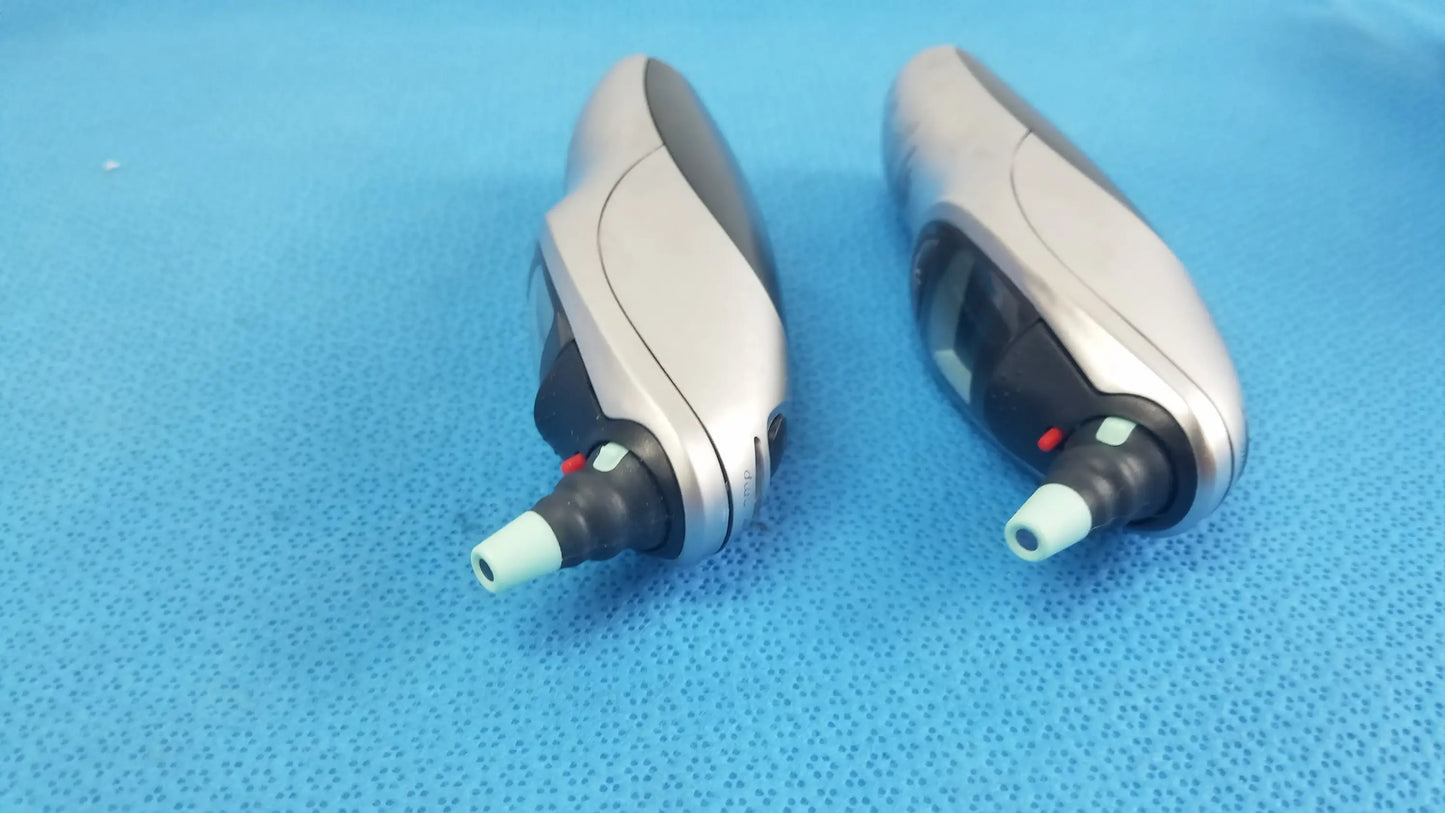Silver and black non-contact infrared thermometer with light blue tip in lot of 2 braun pro 4000 reuse medical equipment set