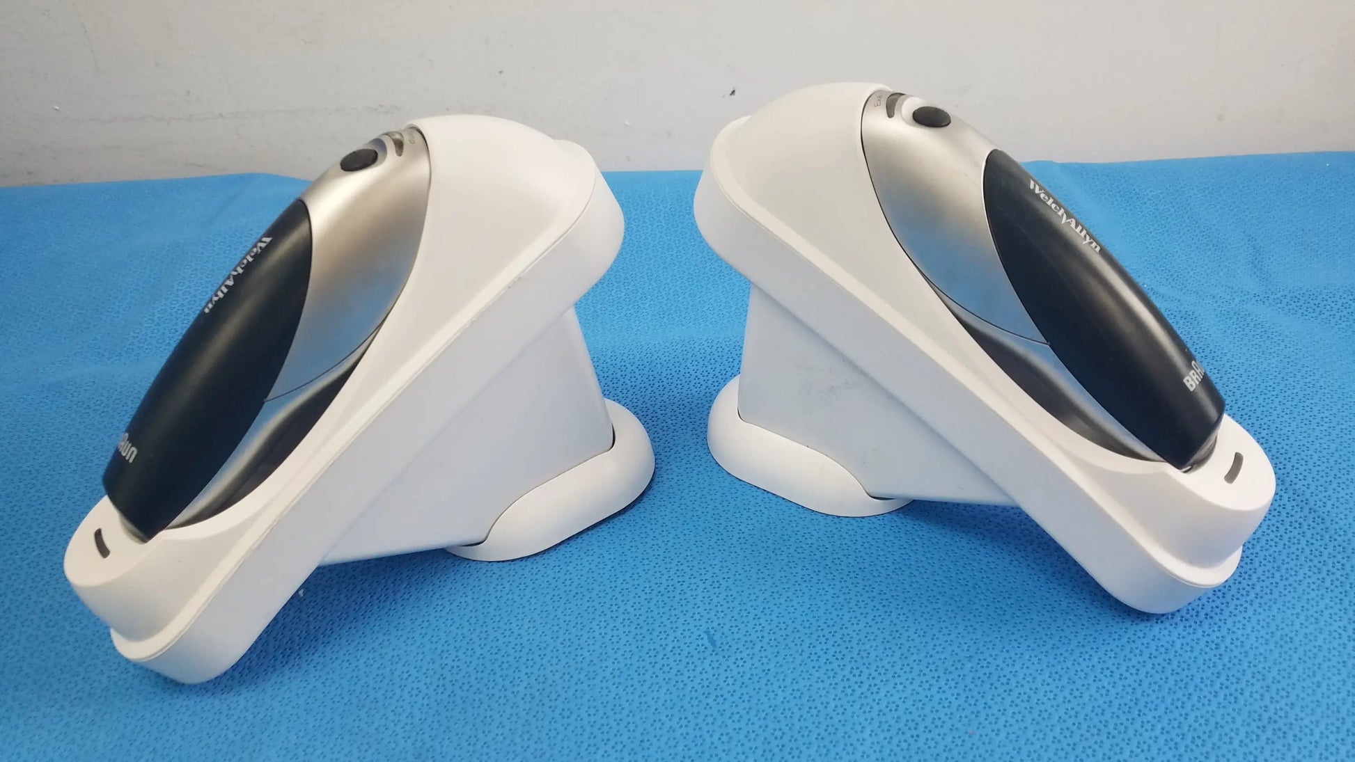 Lot of 2 Braun Pro 4000 ThermoScan medical equipment with Welch Allyn white and black barcode scanners in charging docks