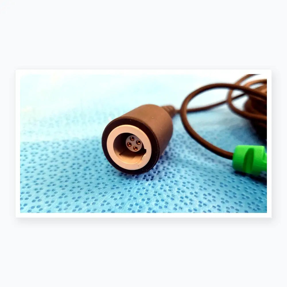Black cylindrical catheter connector cable with silver inner ring and gold pins for reuse medical equipment use
