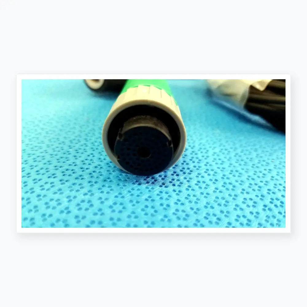 Green and gray plastic garden hose nozzle with perforated spray head shown with lot of 2 ensite x catheter connector cables for reuse medical equipment