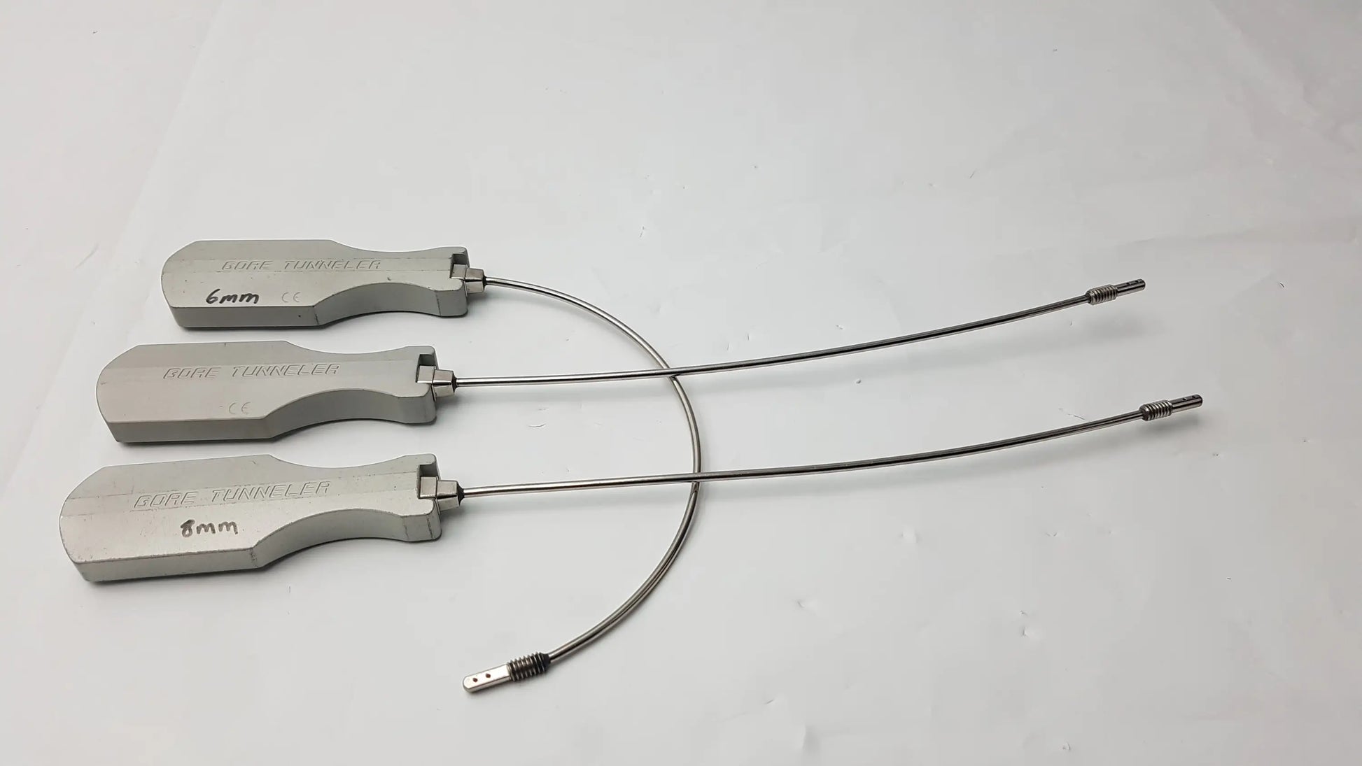 Three silver metal tube turners with engraved handles labeled tube turners featuring slight curve long design